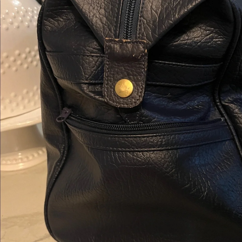 Burberrys Dark Navy Leather Bag with Embroidered Patch